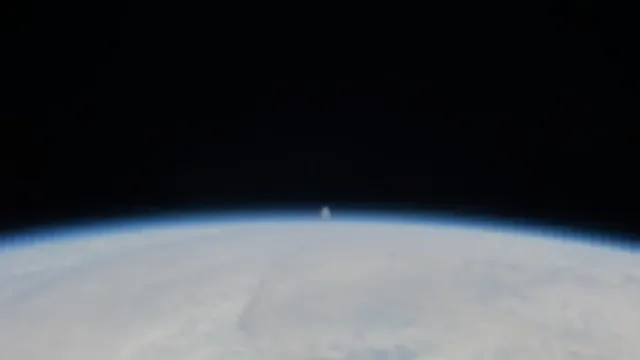 Distant Moon over Earth
